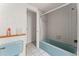 Classic bathroom with a blue bathtub and tiles, offering a functional space at 5 Marina Ter, Treasure Island, FL 33706