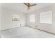 Bare bedroom with two windows and ceiling fan, presenting a blank canvas at 5 Marina Ter, Treasure Island, FL 33706
