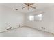 Empty bedroom featuring ceiling fan and window that allows natural light at 5 Marina Ter, Treasure Island, FL 33706