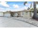 Charming single-story home with stone accents, and a well-manicured yard at 5 Marina Ter, Treasure Island, FL 33706