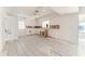 Unfinished kitchen with tile floors, minimal cabinetry and a door leading to the exterior at 5 Marina Ter, Treasure Island, FL 33706