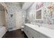 Bathroom featuring floral wallpaper, sink with white vanity, and decorative lighting at 5002 S Shore Crest Cir, Tampa, FL 33609