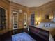 A luxurious bedroom with wood trim, a patterned rug, and a decorative ensuite at 5002 S Shore Crest Cir, Tampa, FL 33609