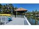 Spacious boat dock with lift, covered roof, and kayak storage provides easy access to water activities at 5002 S Shore Crest Cir, Tampa, FL 33609