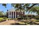 Brick exterior with prominent white columns and manicured front lawn at 5002 S Shore Crest Cir, Tampa, FL 33609