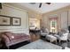 Sitting room with decorative moldings, hardwood floors and view to the main bedroom at 5002 S Shore Crest Cir, Tampa, FL 33609