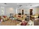 Spacious living room with projector, patterned wallpaper, and ornate seating arrangement at 5002 S Shore Crest Cir, Tampa, FL 33609