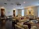 A spacious living room offers hardwood floors, neutral decor and refined furniture at 5002 S Shore Crest Cir, Tampa, FL 33609