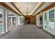 An enclosed patio with columns, brick floor and bar with mirrored doors, opens to the pool at 5002 S Shore Crest Cir, Tampa, FL 33609