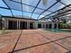 A luxurious pool area, enclosed with brick patio, promises relaxation and enjoyment at 5002 S Shore Crest Cir, Tampa, FL 33609