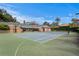 A full-size tennis court is on the property and includes basketball hoops at each end at 5002 S Shore Crest Cir, Tampa, FL 33609