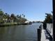 Scenic water view of the canal and surrounding landscaping with palm trees at 5002 S Shore Crest Cir, Tampa, FL 33609