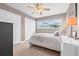 Bedroom featuring two bright windows, ceiling fan, neutral paint and white trim at 5080 43Rd S St, St Petersburg, FL 33711