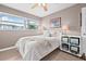 Cozy bedroom featuring a bright window, ceiling fan and neutral decor at 5080 43Rd S St, St Petersburg, FL 33711