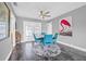Modern dining room featuring a statement art piece, tile floors, and access to the back patio at 5080 43Rd S St, St Petersburg, FL 33711