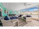 Enjoy outdoor living in the lanai featuring a dining area, comfortable lounge chairs, and a view of the private pool at 5080 43Rd S St, St Petersburg, FL 33711