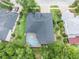 Stunning aerial view of the home featuring a private pool and lush landscaping at 5101 Hartwell Loop, Land O Lakes, FL 34638