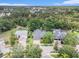 Gorgeous community aerial view featuring lush trees and neighborhood at 5101 Hartwell Loop, Land O Lakes, FL 34638