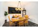 Dining room showcasing a wooden table with matching chairs and a chalkboard wall for a unique touch at 5101 Hartwell Loop, Land O Lakes, FL 34638