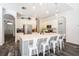 Bright kitchen features a large island with counter seating and stainless steel appliances at 5101 Hartwell Loop, Land O Lakes, FL 34638