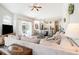 Cozy living room with open access to kitchen and sliding glass doors to a covered patio at 5101 Hartwell Loop, Land O Lakes, FL 34638