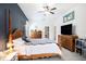 Spacious main bedroom with en-suite bath and a dark accent wall at 5101 Hartwell Loop, Land O Lakes, FL 34638