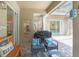 Outdoor space featuring a built-in grill, and comfortable seating under a screened patio at 5101 Hartwell Loop, Land O Lakes, FL 34638