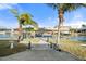 This beautifully landscaped backyard has direct access to a dock, boat lift and the waterfront at 5108 Commonwealth Rd, Palmetto, FL 34221