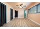 Open bedroom with wood floors at 5108 Commonwealth Rd, Palmetto, FL 34221