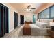 Cozy bedroom with a ceiling fan, wood floors and decor at 5108 Commonwealth Rd, Palmetto, FL 34221