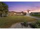 Charming single-story home featuring a well-manicured lawn and mature palm trees at 5108 Commonwealth Rd, Palmetto, FL 34221
