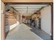 View of the attached garage, including shelving for storage at 5108 Commonwealth Rd, Palmetto, FL 34221