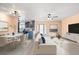 Open-concept living and dining area with stylish decor, and kitchen access at 5108 Commonwealth Rd, Palmetto, FL 34221