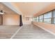 Open living area with wood flooring and a large picture window with waterfront views at 5108 Commonwealth Rd, Palmetto, FL 34221