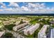 A vibrant community featuring lush greenery, several residential buildings, and ample parking at 5623 80Th N St # 504, St Petersburg, FL 33709
