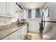 Updated kitchen with granite countertops and stainless steel appliances at 5623 80Th N St # 504, St Petersburg, FL 33709