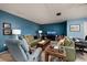 Cozy living area with two sofas, a recliner, and plenty of natural light at 5623 80Th N St # 504, St Petersburg, FL 33709