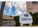 Sign for Georgetown condo association under a blue sky with clouds at 5623 80Th N St # 504, St Petersburg, FL 33709