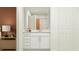 Bright bathroom with a white vanity, modern sink, and a glimpse of the shower creating a clean, fresh space at 5627 Red Kite Dr, Wimauma, FL 33598