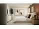 Serene bedroom with a comfortable bed, stylish bedside tables, and modern decor at 5627 Red Kite Dr, Wimauma, FL 33598