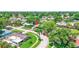 Aerial view of the property in a tropical neighborhood with mature landscaping at 5835 29Th N Ave, St Petersburg, FL 33710