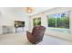 Bright living room featuring tile floors, ceiling fan and sliding glass doors overlooking the pool at 5835 29Th N Ave, St Petersburg, FL 33710