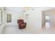 Bright living room featuring tile floors and comfortable seating area with a recliner chair at 5835 29Th N Ave, St Petersburg, FL 33710