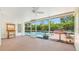 Enclosed patio with views of the pool area and surrounding greenery at 5835 29Th N Ave, St Petersburg, FL 33710