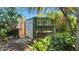 Exterior view of a shed surrounded by tropical landscaping in the backyard at 5835 29Th N Ave, St Petersburg, FL 33710