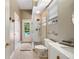 Bright bathroom featuring a walk-in shower, modern sink, and direct access to the outdoor pool area at 6212 Nimes Ct, Lutz, FL 33558