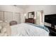 Spacious bedroom with a dresser, walk-in closet, and neutral paint at 6212 Nimes Ct, Lutz, FL 33558