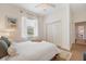 Inviting bedroom features natural light, closet, and hardwood floors at 6212 Nimes Ct, Lutz, FL 33558
