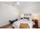 Airy bedroom features ceiling fan, bench, and cozy decor at 6212 Nimes Ct, Lutz, FL 33558