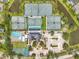 Aerial shot of neighborhood featuring tennis courts, basketball courts, and a swimming pool at 6212 Nimes Ct, Lutz, FL 33558